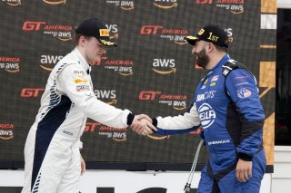 #098 Porsche 718 Cayman GT4 of Isaac Sherman, Rotek Racing, GT America, GT4, #25 Aston Martin Vantage AMR GT4 of Gray Newell, Heart of Racing Team, SRO America, Road America, Elkhart Lake, WI, August 2024.
 | Brian Cleary/SRO